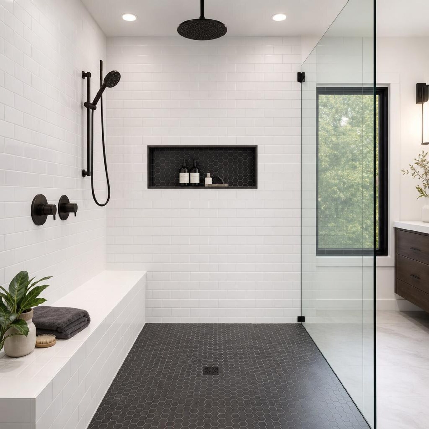 Walk-in shower remodel with built-in niche and frameless glass